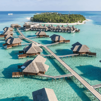 Overwater bungalows at sunset in the Maldives