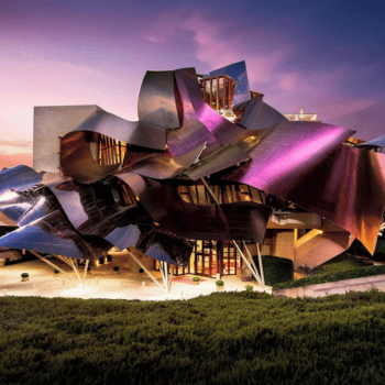 Modern architectural hotel with curved metal design at sunset