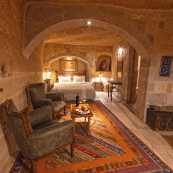 Stone-carved cave suite with traditional Turkish decor