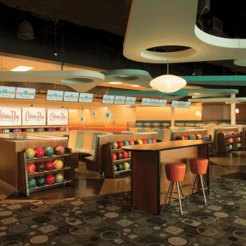🏖️ Cabana Bay Beach Resort Review with Volcano Bay View – A Fantastic Family Hotel 20 Mid-century modern bowling alley with colourful bowling balls, booths, and Cabana Bay branding