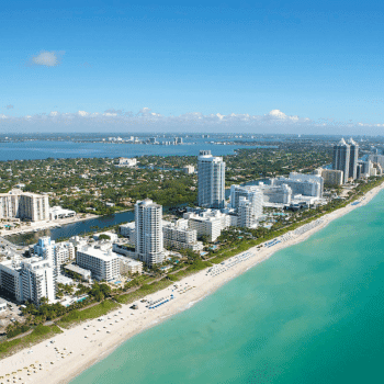 ✈️ Flight Search and Travel Deals All in One Place – Compare, Save, Go! 18 White sand beach with turquoise water and modern hotels along the Miami coastline
