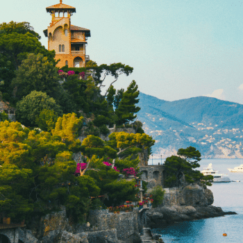 Ultimate Portofino Travel Guide: Best Places to Stay, Eat & Explore 🧭 5 Towering villa nestled among trees above the Ligurian Sea with yachts in the background