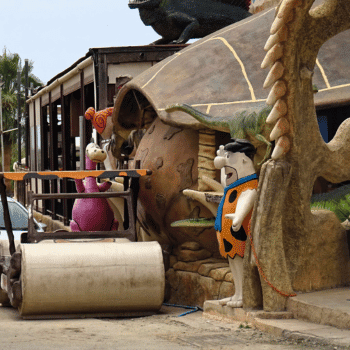 Ayia Napa in May – A Mum & Daughter Escape 🌊☀️ 30 Flintstones statues and themed décor outside a restaurant in Ayia Napa.