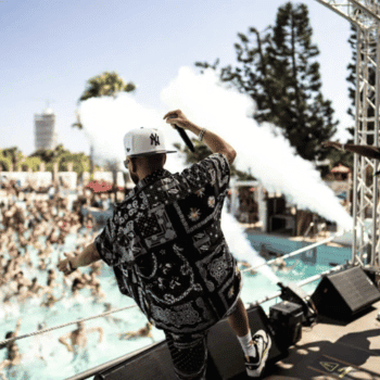 Ayia Napa in May – A Mum & Daughter Escape 🌊☀️ 50 DJ performing on stage at a daytime pool party in Ayia Napa with a crowd dancing in the water