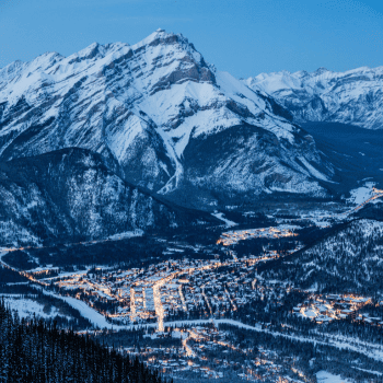 Snow-capped mountains and frozen lake in Banff National Park, Canada