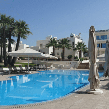Ayia Napa in May – A Mum & Daughter Escape 🌊☀️ 9 Relax by the sparkling outdoor pool at La Casa Di Napa, complete with sun loungers, umbrellas, and a backdrop of tropical palms. Discover Ayia Napa in May – quieter beaches, history, day trips & fun. Ayia Napa in May