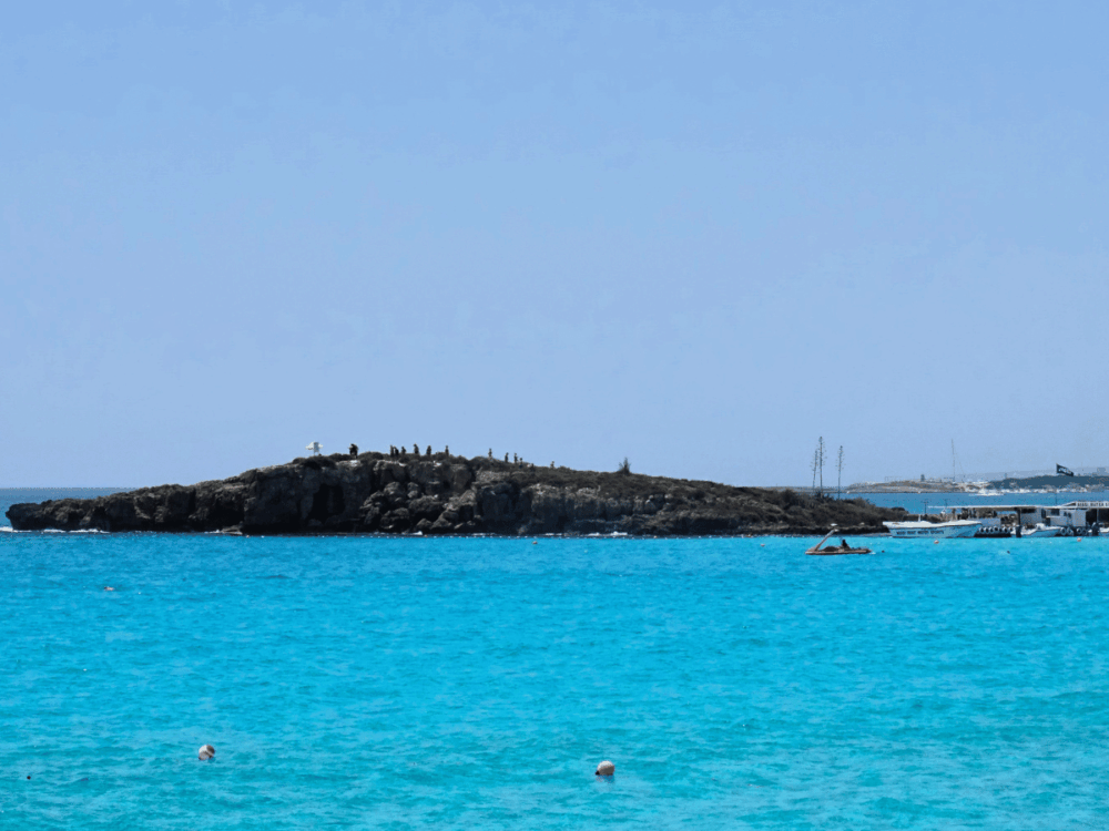 View of the small island and turquoise sea at Nissi Beach