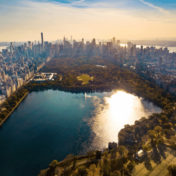 Aerial view of Central Park lake and Manhattan skyscrapers at sunset, New York City