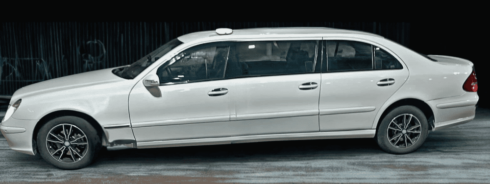 Ayia Napa in May – A Mum & Daughter Escape 🌊☀️ 8 White extended taxi vehicle parked on a city street, designed for private transfers with extra passenger space