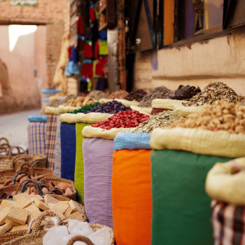 Bright sacks of spices on display in a Marrakech Medina market, Morocco