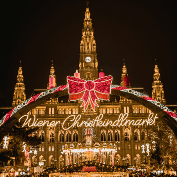 Compare Flights and Travel Essentials 18 Wiener Christkindlmarkt sign at Vienna Christmas Market in front of Rathausplatz