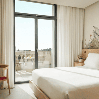 Modern bedroom with balcony seating at 45 Times Barcelona in Barcelona, Spain