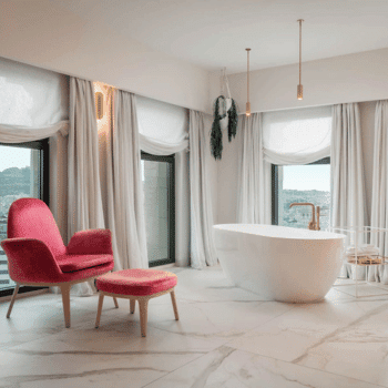 Freestanding bathtub and modern decor in suite at 45 Times Barcelona