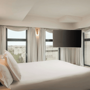 Contemporary bedroom with panoramic windows and TV at 45 Times Barcelona