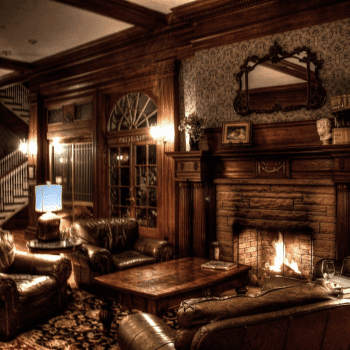 🎃 Spooky Season Travel Deals & Haunted Adventures ✈️👻 7 Cosy leather armchairs and a glowing fireplace inside the historic Stanley Hotel in Estes Park, Colorado