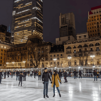 Christmas Market Trip Planner 8 Ice skaters enjoying the winter rink at Bryant Park surrounded by city lights in New York City