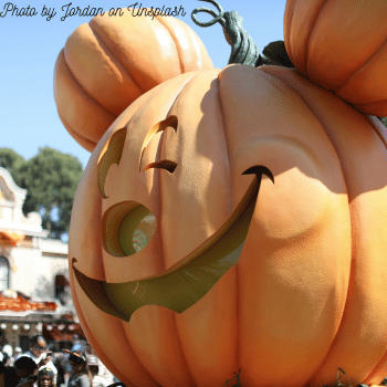 Compare Flights and Travel Essentials 37 Close-up of a large Mickey pumpkin at Disneyland Paris during the Halloween parade.