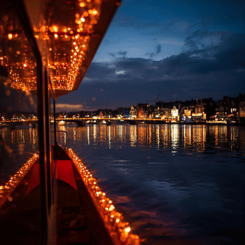 Christmas Market Trip Planner 9 Boat deck decorated with Christmas lights reflecting over calm evening water