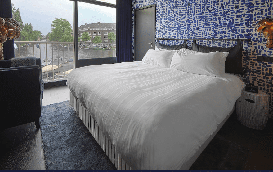 Compare Flights and Travel Essentials 110 Bedroom with canal view at Apollo Hotel Amsterdam