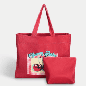 Red OHS beach bag with “Cherry Baby” graphic and matching pouch displayed together for travel and beach use