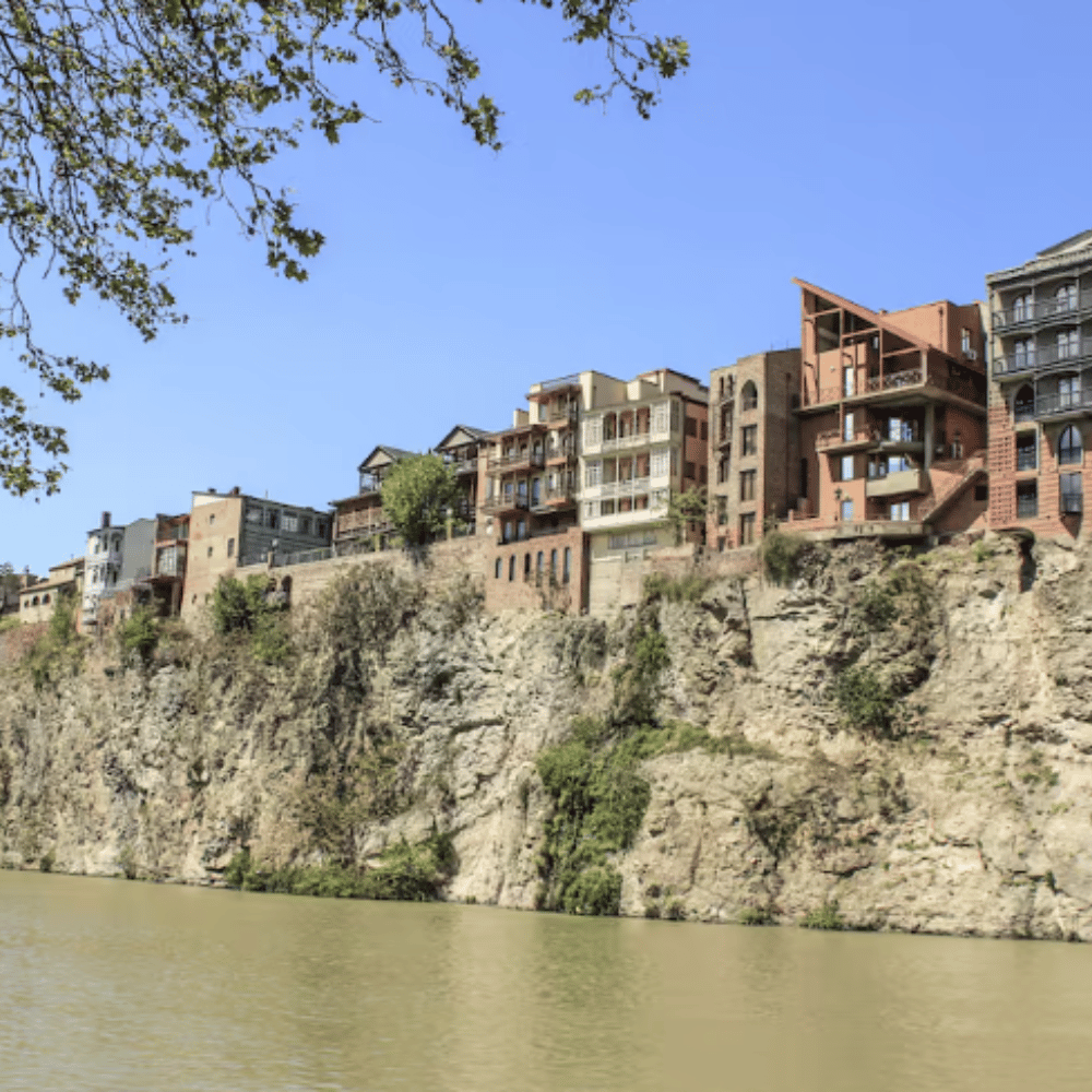 Buildings on a cliff above the river in the Metekhi area of Tbilisi Georgia