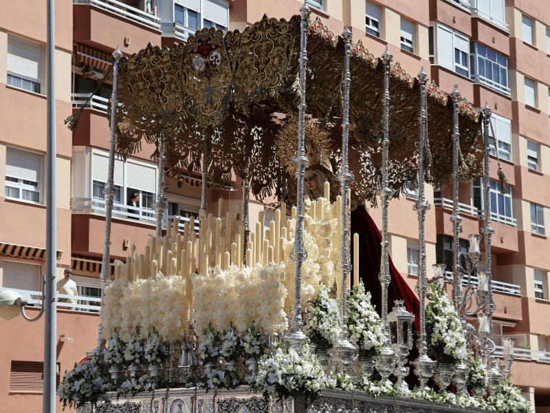 Semana Santa float decorated with candles and flowers