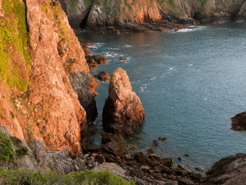 Rocky cliffs and sea along Jersey coastline