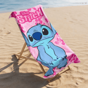 Disney Stitch beach towel on a beach chair beside the sea
