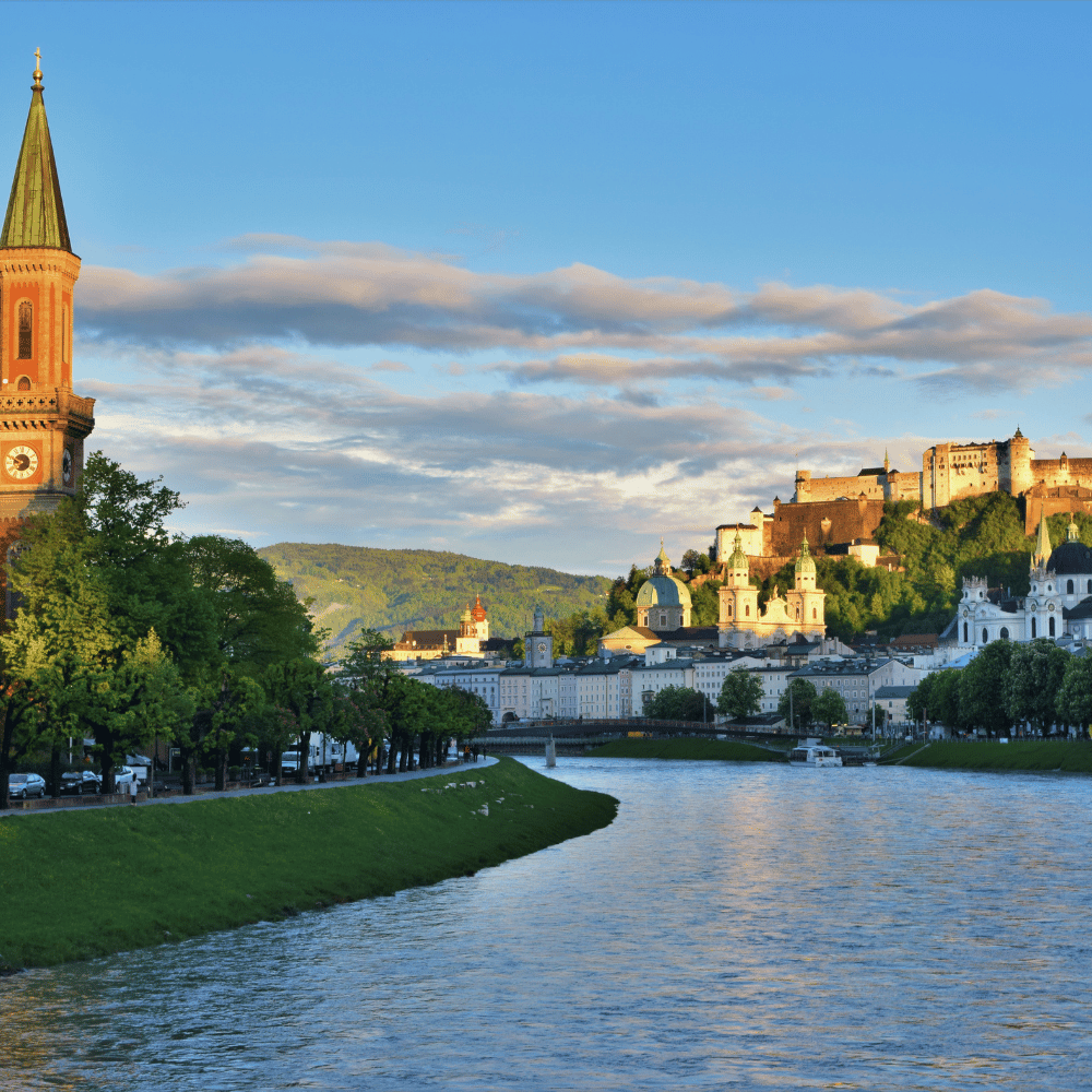 Compare Flights and Travel Essentials 15 Salzach River running through Salzburg with Hohensalzburg Fortress in the distance