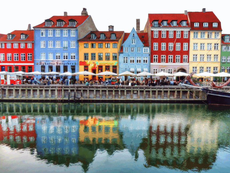 Colourful historic townhouses and waterfront cafés along Nyhavn in Copenhagen