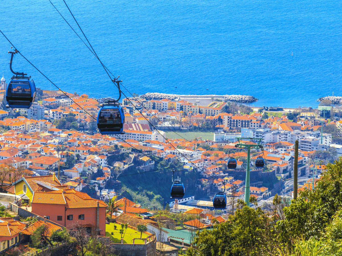 Cable cars overlooking Funchal and the Atlantic Ocean in Madeira.