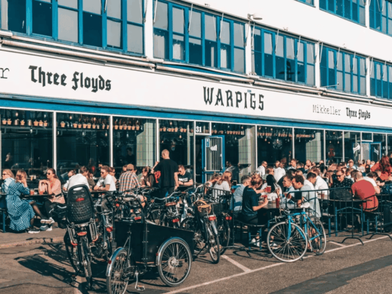 Busy outdoor seating and bicycles in Vesterbro, Copenhagen