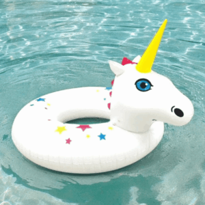 Giant Magic Unicorn Pool Float in a styled pool setting