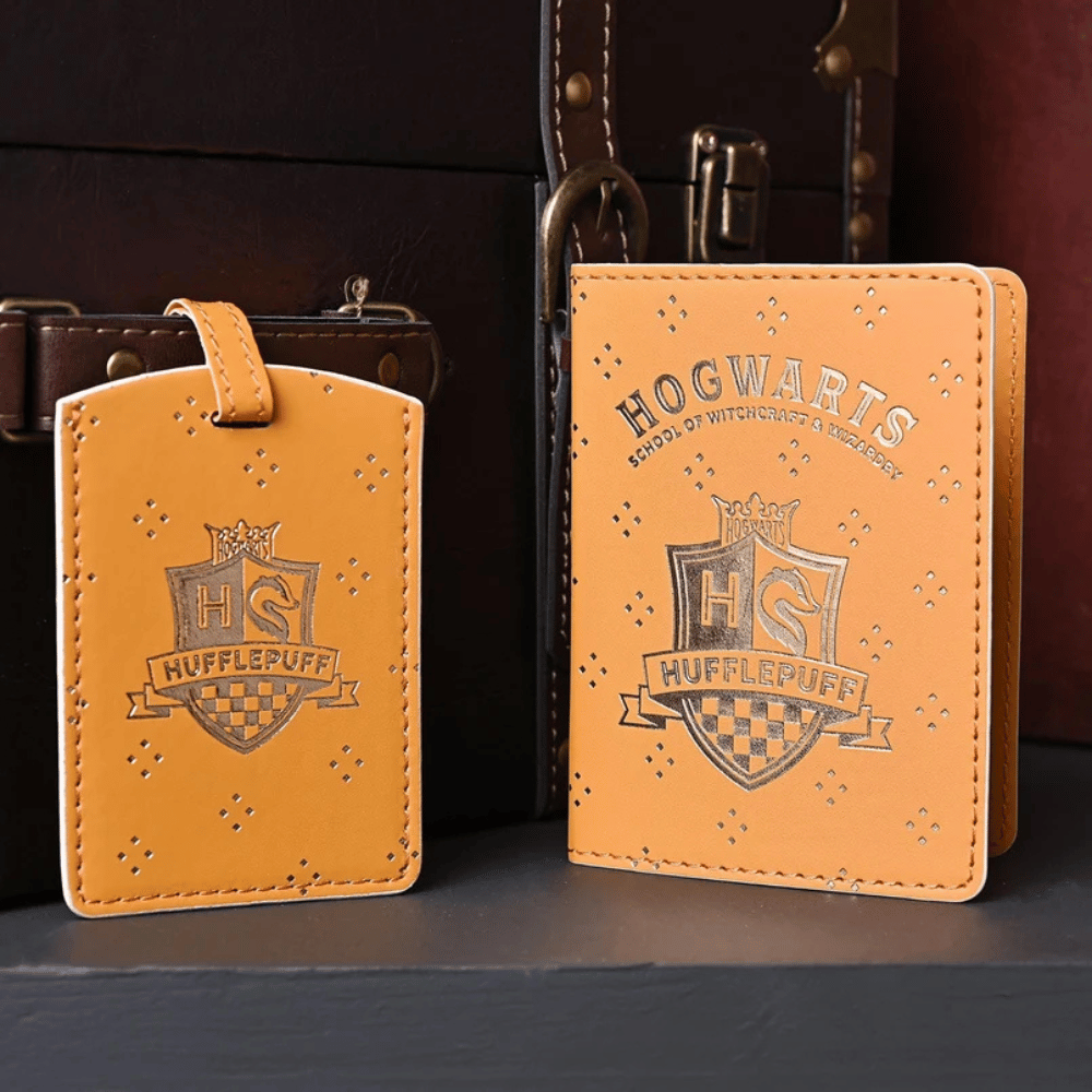 Air-Holiday | Smarter Holiday Planning, Deals & Inspiration 24 Yellow and gold Hufflepuff passport holder and luggage tag decorated with the Hogwarts crest and stars