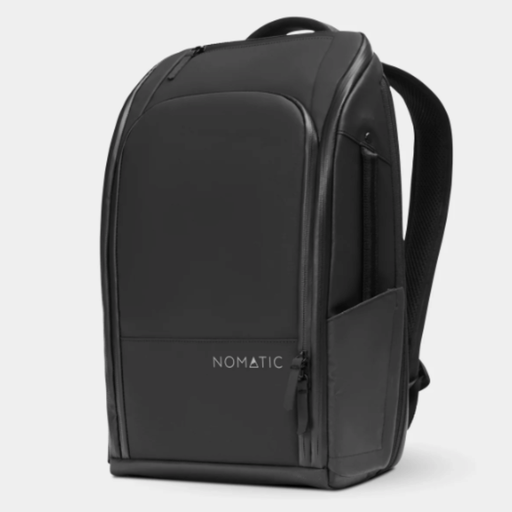 Black Nomatic Backpack shown at an angle with a zipped front pocket, Nomatic logo, side pocket and top handle.